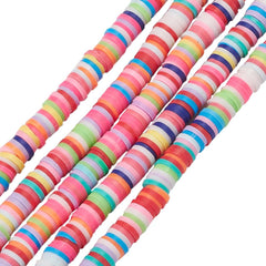 Close-up of striped polymer clay disc beads in many vivid colours