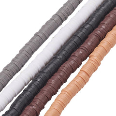 Close-up of stacked polymer clay disc beads in black, grey, brown and peach shades