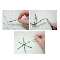 Hands threading beads onto the large wire snowflake form to create a colourful ornament